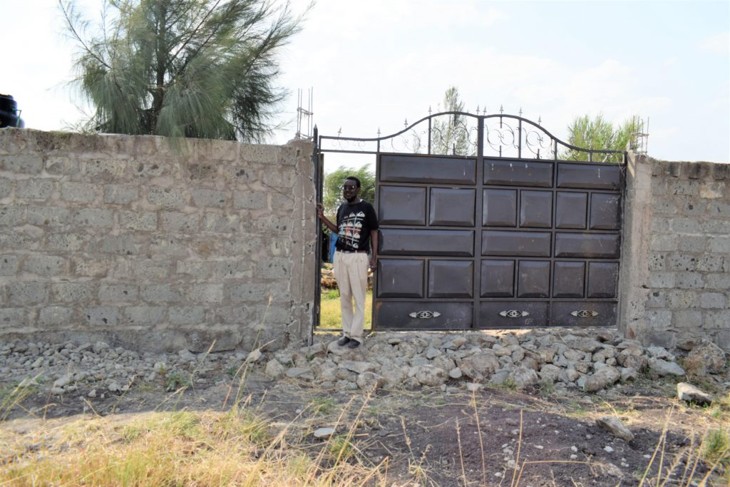 Peter Mwangi Gitika at the entrance of Gitika pig farm