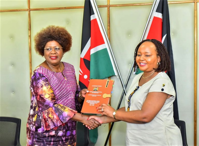 CS Alice Wahome and Governor Waiguru exchange documents after signing the NAWASIP plan