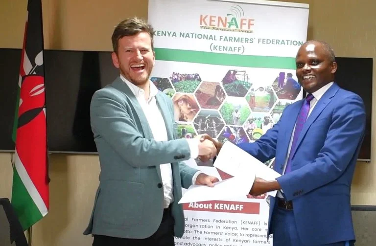 Cees Peter van den Brink left from iCRA and Daniel Mwendah the KENAFF Chief Executive Officer exchanges documents after the MOU signing