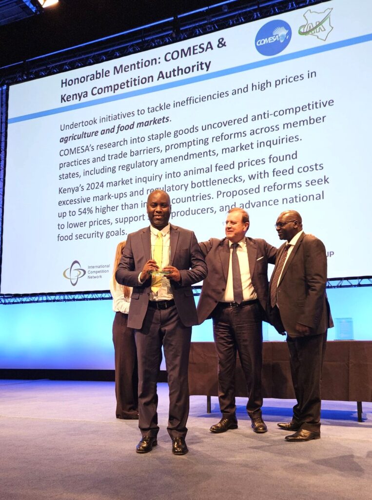 COMESA Competition Commission Recognised for Tackling Food Inefficiencies The COMESA Competition Commission Director and Chief Executive Officer Dr Willard Mwemba with the award