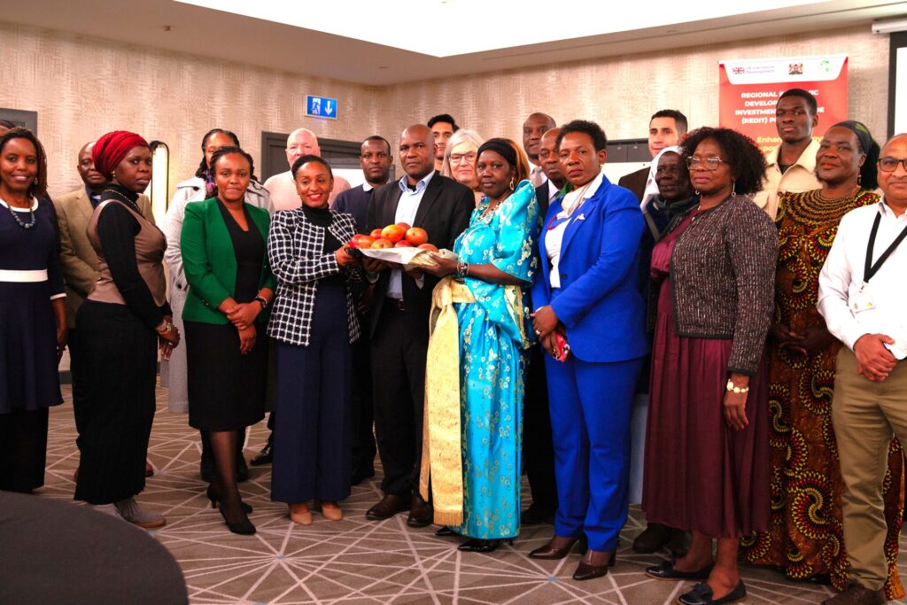 Lillian Mwai L Kenya Country Director at TradeMark Africa hands over the mango consignment to Ali Mambo Charge dAffaires at the Kenya High Commission in the UK and Pauline Lamunu Director at Gaute F